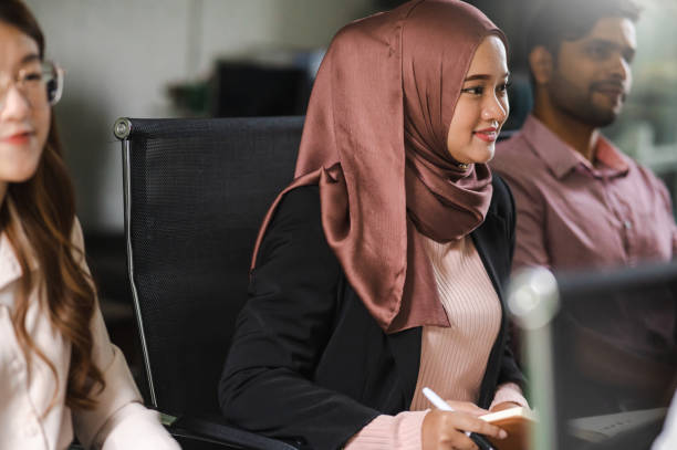istock Together We Succeed: Multiracial Businesspeople Collaborating in the Modern Era 1472030616