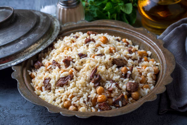 istock Traditional Turkish food; Roasted meat on rice (Turkish name; pilav üstü kavurma, kurban kavurma, nohutlu etli pilav) 1472030725