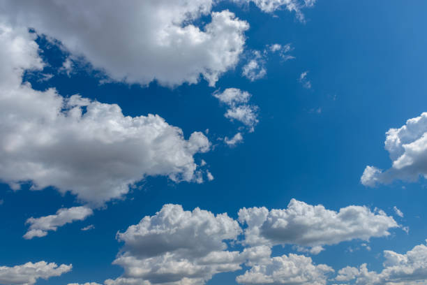 istock Blue sky with white fluffy clouds background. Summer blue sky and white cloud white background. Beautiful clear cloudy in sunlight calm season 1472032168