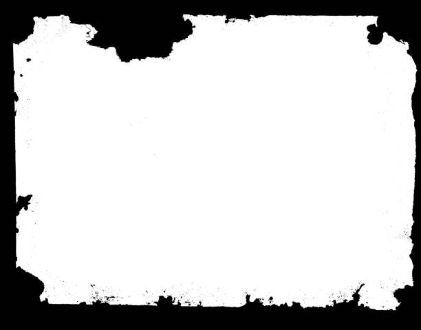 Cut or torn paper background textured isolated on black.