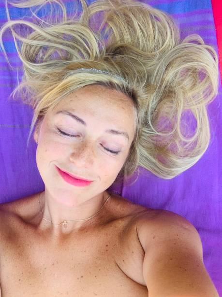 istock Blond smiling woman with closed eyes. 1472033680