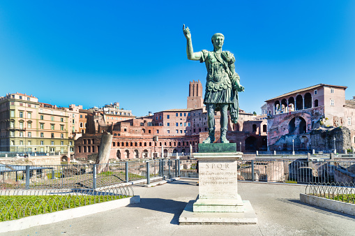 Equestrian Monument of Cosimo I, Piazza della Signoria, Florence, Tuscany, Italy. This bronze equestrian statue was designed by sculptor Giambologna and erected in 1594. Cosimo I de' Medici was the Duke of Florence and the first Grand Duke of Tuscany. Florence is the capital city of the region of Tuscany. It was established by Julius Caesar in 59 BC and was a centre of medieval European trade and finance and one of the wealthiest cities of the time. It was also the birthplace of the Italian Renaissance. Blue sky is in background.