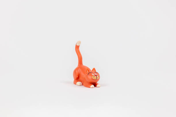 istock cat figure children's toy on a white background 1472037324