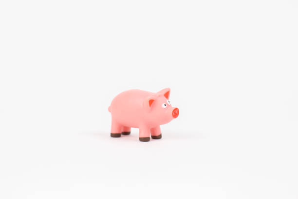 istock figurine pig children's toy on a white background 1472037535