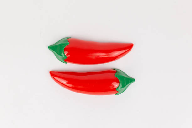 istock plastic toy chili pepper on a white background 1472037678