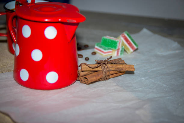 Flat lay a cup of coffee and chocolate, candies and cotton candy as a frame