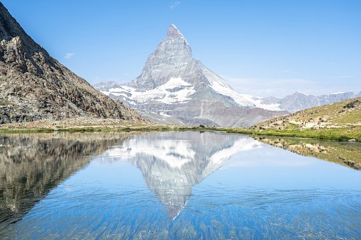 Matterhorn reflection in Riffelsee on a summer day, Zermatt, Switzerland