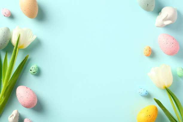 istock Happy Easter greeting card template. Double border frame made of colorful Easter eggs, tulips, decorative bunny. 1472050893