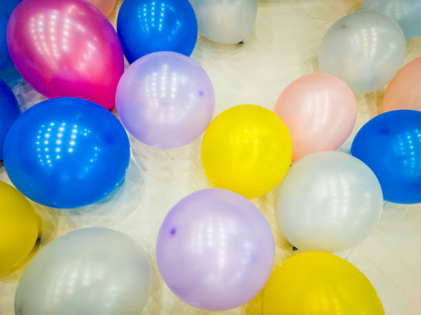 istock Balloons scattered on the floor after being used as event decorations. 1472053683