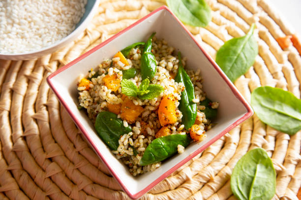 istock Delicious rice salad with pumpkin and spinach 1472054005