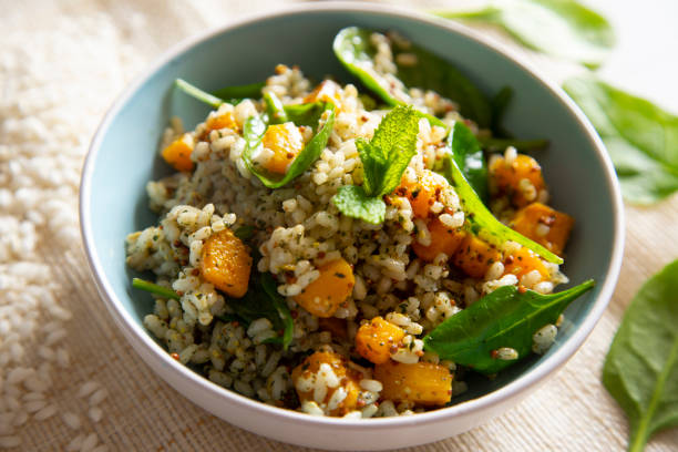 istock Delicious rice salad with pumpkin and spinach 1472054023