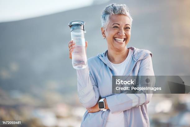 Fitness Happy Or Old Woman With Water Bottle In Nature To Start Training Exercise Or Hiking Workout In New Zealand Portrait Liquid Or Healthy Senior Person Smiles With Pride Goals Or Motivation Stock Photo - Download Image Now
