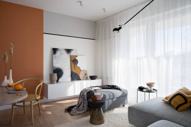 Bright living room with orange wall stock photo
