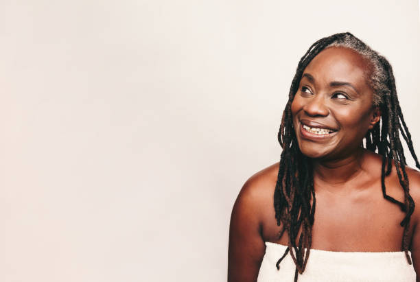 istock Refreshed woman looking away with a smile in a studio 1472059202
