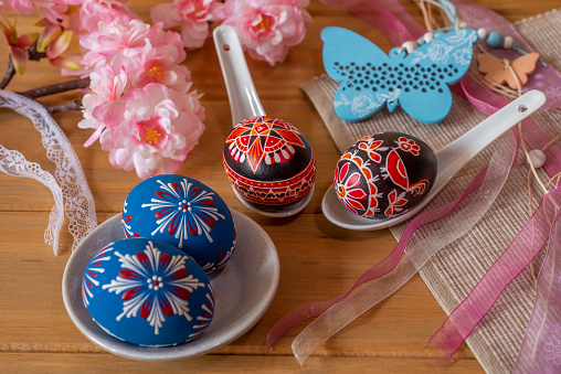 hand painted red sorbian easter eggs and easter decoration on a table