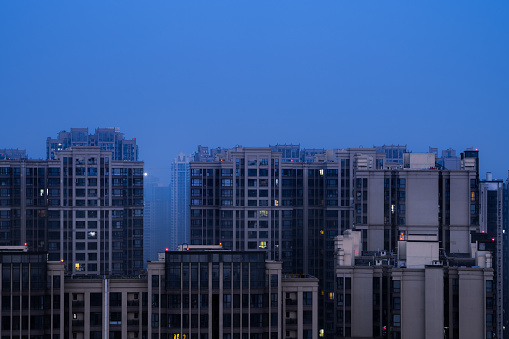 Modern residential buildings under moonlight