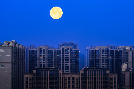 Modern residential buildings under moonlight
