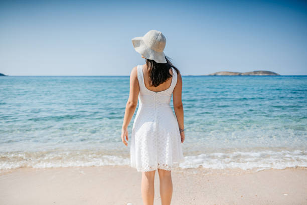 istock Young Woman Standing On The Beach In Thasos 1472068657