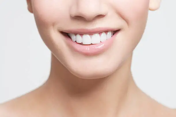 Photo of Close up of smiling woman's mouth