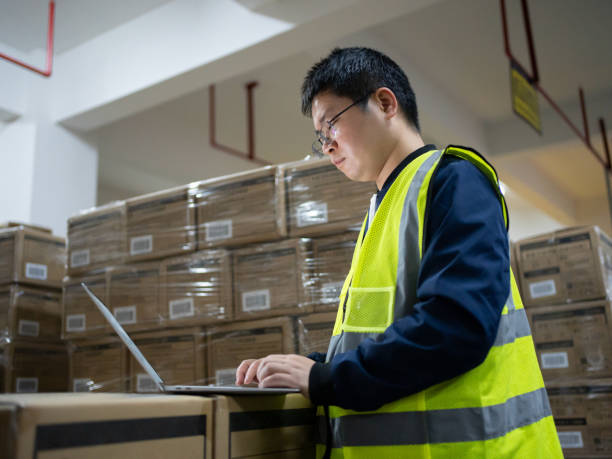 istock The warehouse clerk is checking the goods 1472073796