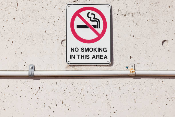 istock No smoking sign on a concrete wall 1472075025