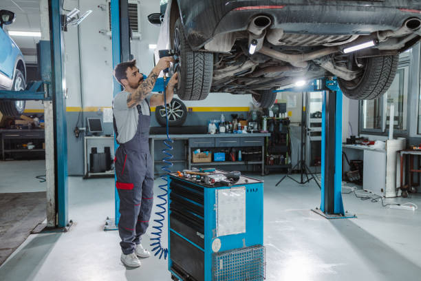 istock Automotive technician working at the service station 1472076688