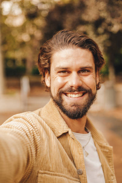istock young hipster man selfie pov peace symbol 1472077373