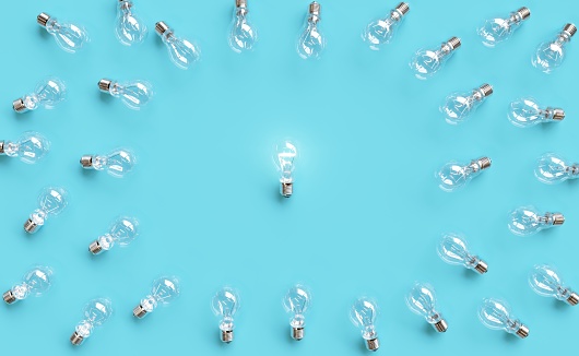 Outstanding Lighting bulb layout made with Many Lighting bulb on pastel blue background. Minimal idea concept background. Creative copy space. Flat lay. 3D Render