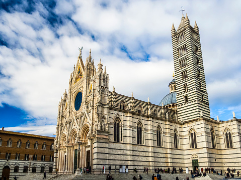 Siena, Italy - December 27, 2013:Santa Maria Assunta Cathedral in Siena, Italy. Made between 1215 and 1263, it is a major tourism attraction in Siena.