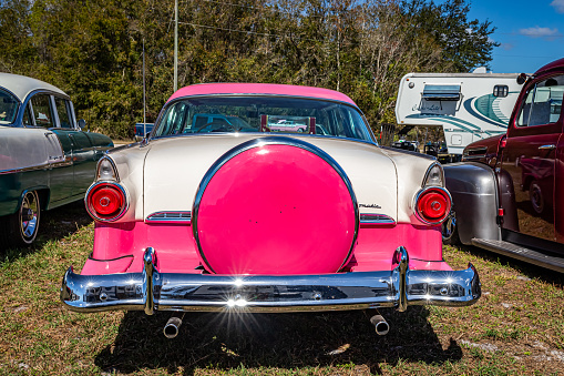 Fort Meade, FL - February 24, 2022: High perspective rear view of a 1955 Ford Fairlane  Crown Victoria 2 Door Sedan at a local car show.