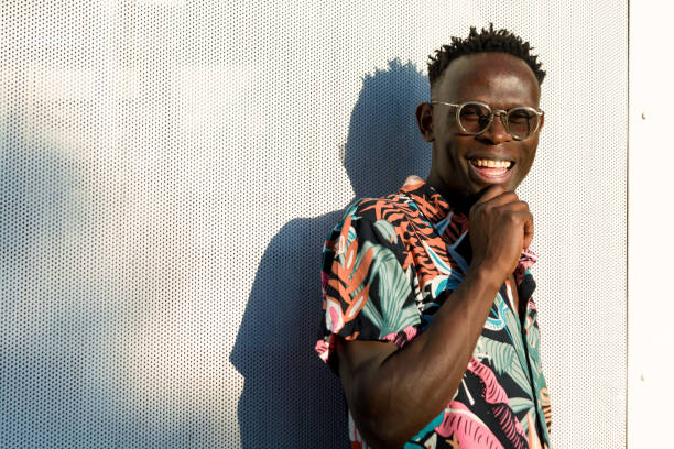 portrait of young happy man of African ethnicity, immigrant student in Argentina. stock photo