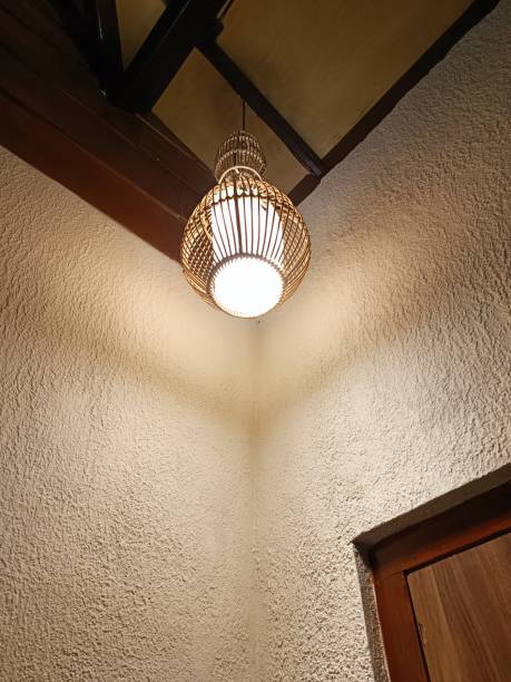 istock Rattan lamp in industrial interior 1472085917