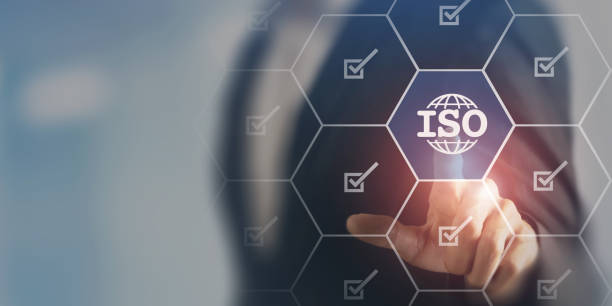 istock ISO standards quality control, assurance and warranty business technology concept. Touching on screen with ISO and globe icons on smart background. ISO Standard certification. Modern ISO banner. 1472086290