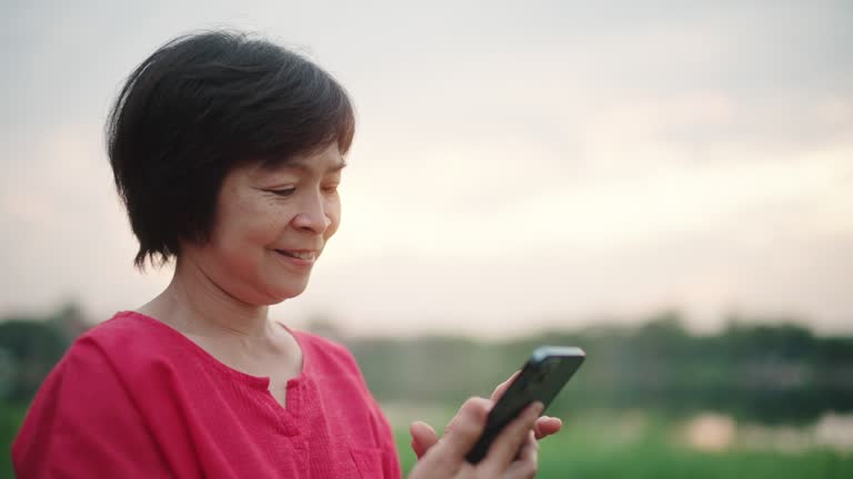 Happy woman using smartphone.