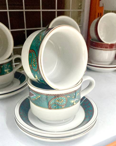 istock Close up of stacked green and white cups 1472087307