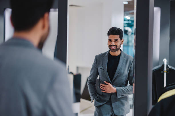 Young man shopping in clothing store