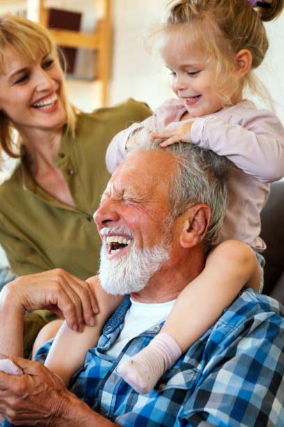 istock Cheerful multi-generation family having fun while spending time together at home. 1472088194