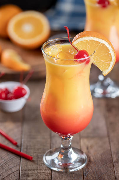 istock Tequila sunrise cocktail garnished with cherry and orange slice 1472091223