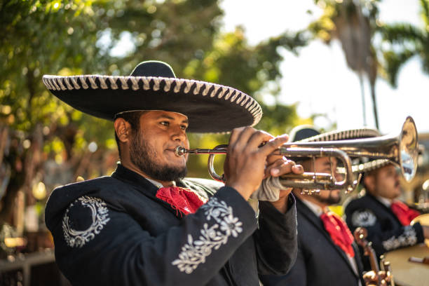 istock Traditional mariachi trumpeter playing outdoors 1472093801