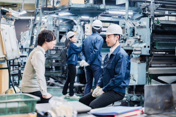 istock Male students undergoing an employment interview at a factory 1472096262