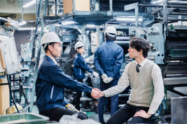 istock Male students undergoing an employment interview at a factory 1472096269