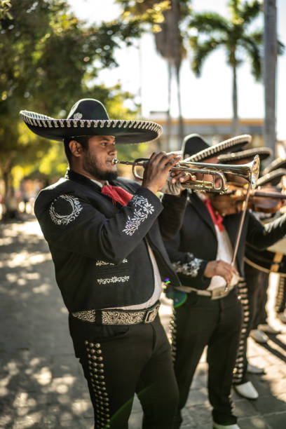 istock Traditional mariachi trumpeter playing outdoors 1472098089