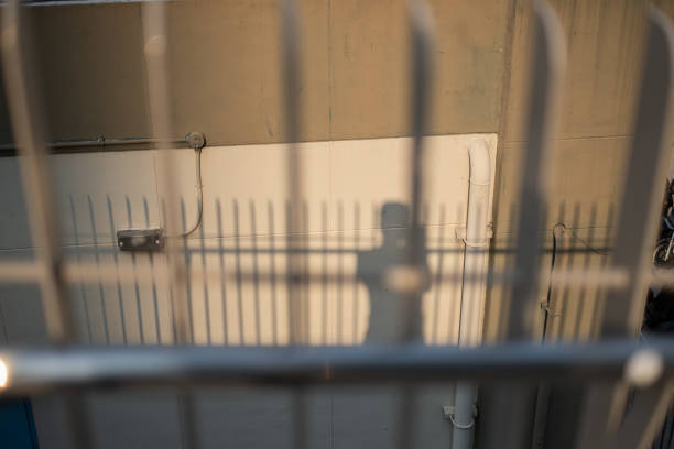 Shadow on the wall with iron fence