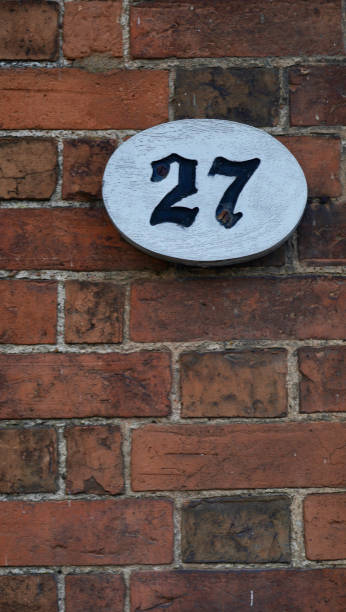 istock House number 27 in black on a white oval 1472099064