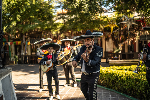 Traditional group of mariachis playing at the historic district