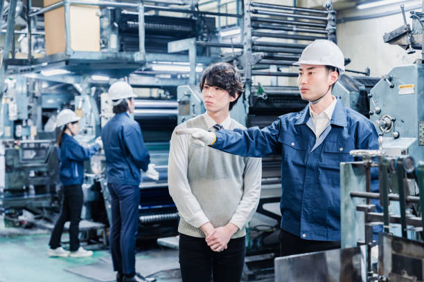 istock Male students touring the factory 1472099683