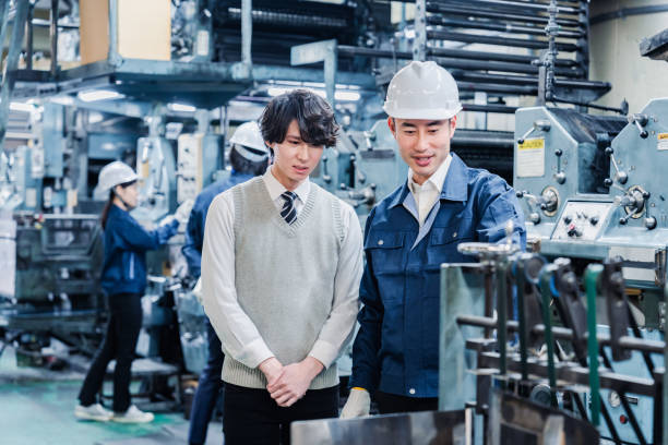 istock Male students touring the factory 1472099691