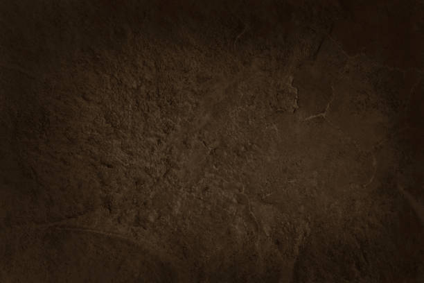 istock Dark brown slate stone wall texture background in natural pattern for decorative interior and exterior. 1472100351