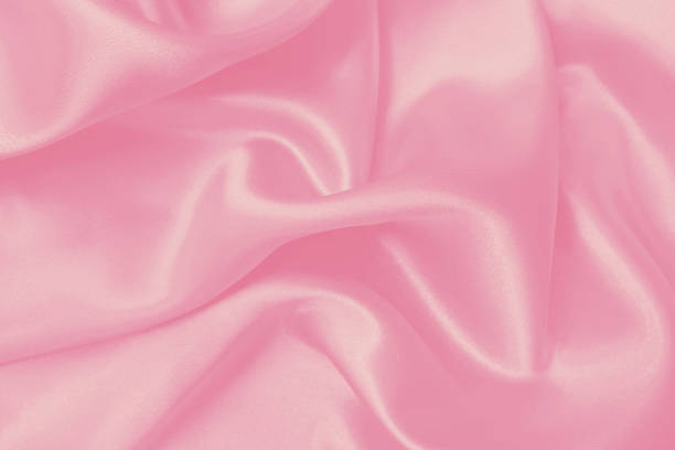 istock Soft pink fabric texture background, detail of silk or linen pattern. 1472100427