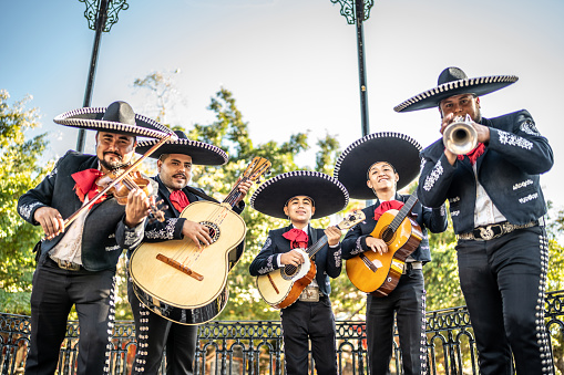 Portrait of group of traditional mariachis playing at the historic district
